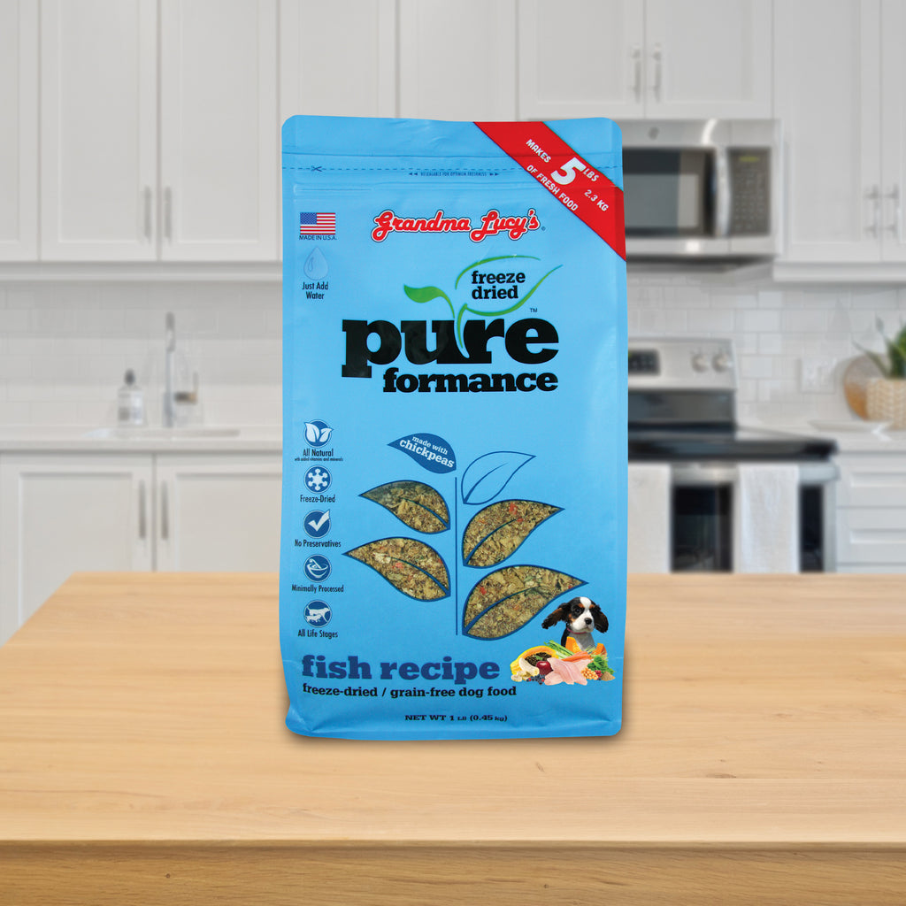 A 1 lb bag of Grandma Lucy's Pureformance fish dog food displayed on a kitchen counter.